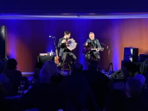 Two musicians playing in the Blue Room